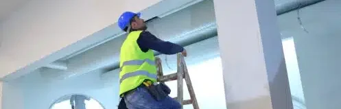 man checking ductwork