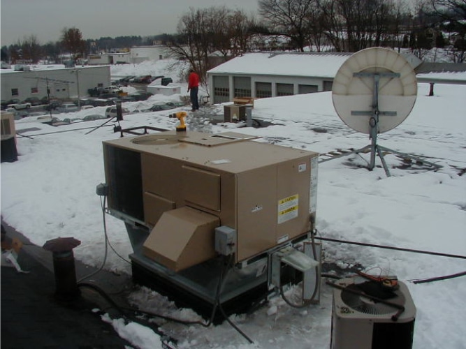 Commercial HVAC Unit on roof of building in snow