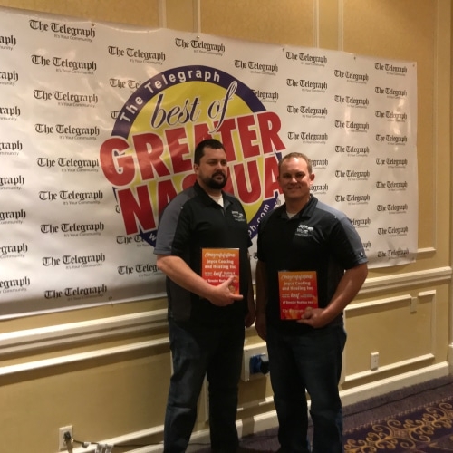 Owners of joyce heating and cooling holding an award