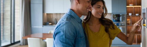 couple by a thermostat
