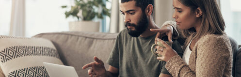 A couple checking the internet while buying a new HVAC system